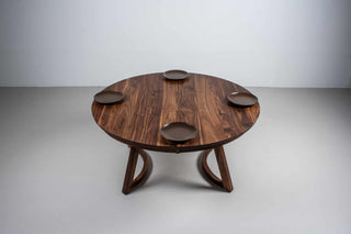 large round walnut expandable table on chesbro legs with hamelin edge