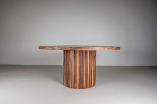 round walnut dining table on fluted walnut pedestal base
