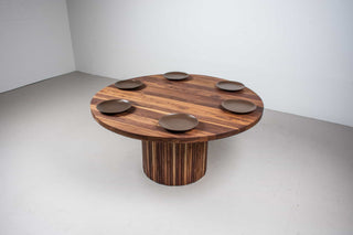 round walnut dining table on fluted walnut pedestal base