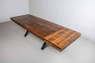 rustic wood table on industrial beam base