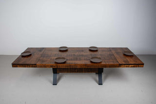 rustic wood table on industrial beam base