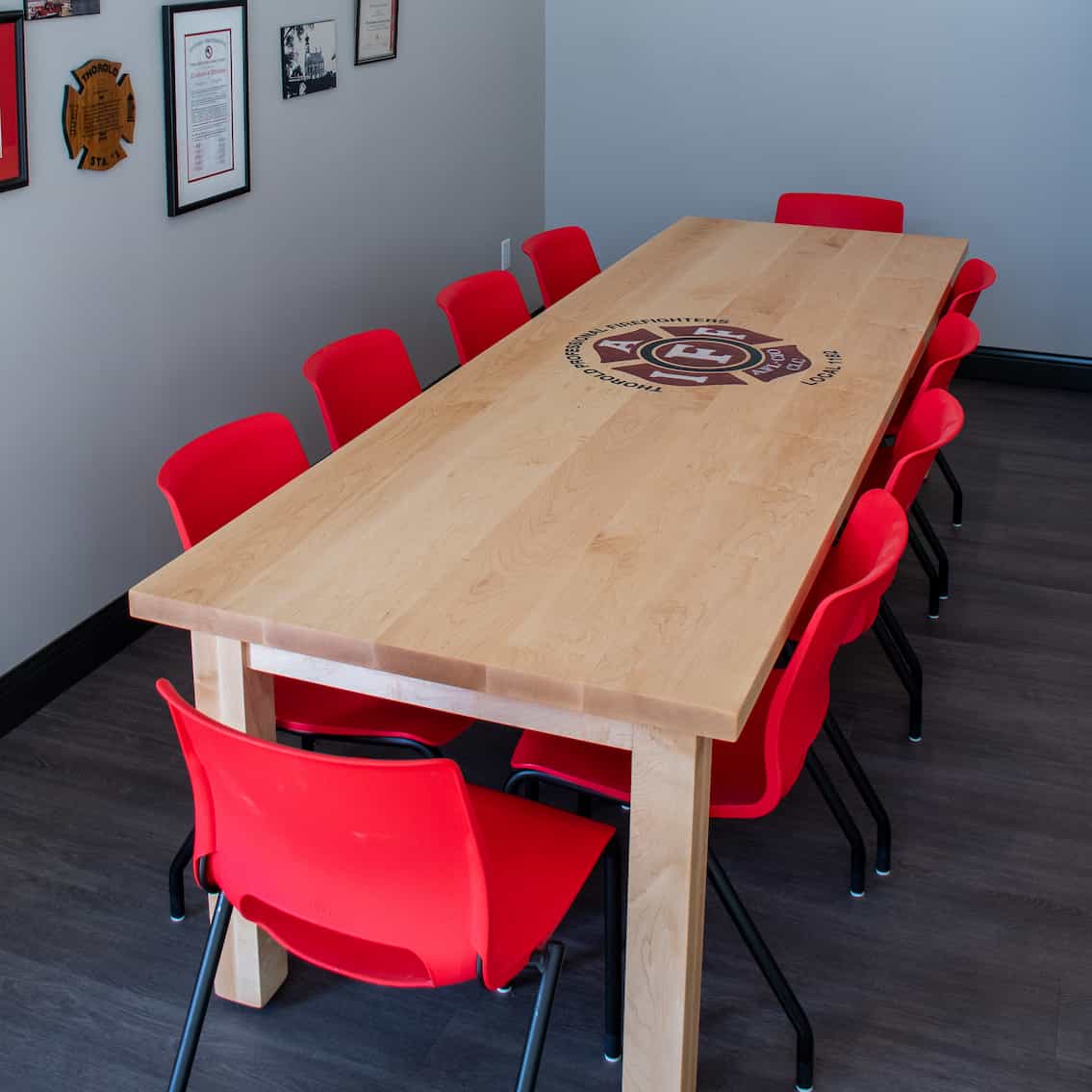custom maple conference table with inlaid epoxy logo