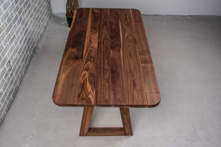 small walnut dining table on walnut angle legs