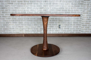 small walnut table on pedestal base