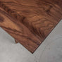 corner of a Walnut table 48