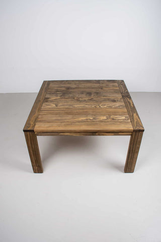 square outdoor table on parson style base