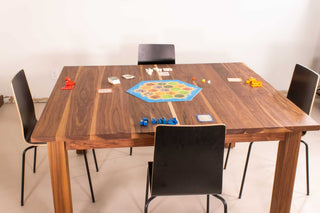 square walnut games table on a parsons base