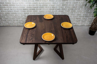 square extendable table in blackened walnut