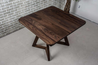 square extendable table in blackened walnut