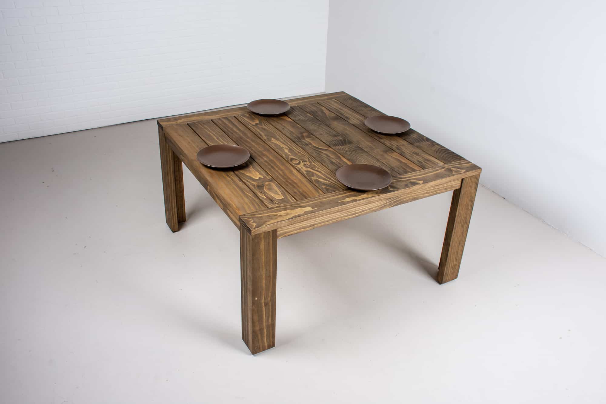 square outdoor dining table made with accoya wood