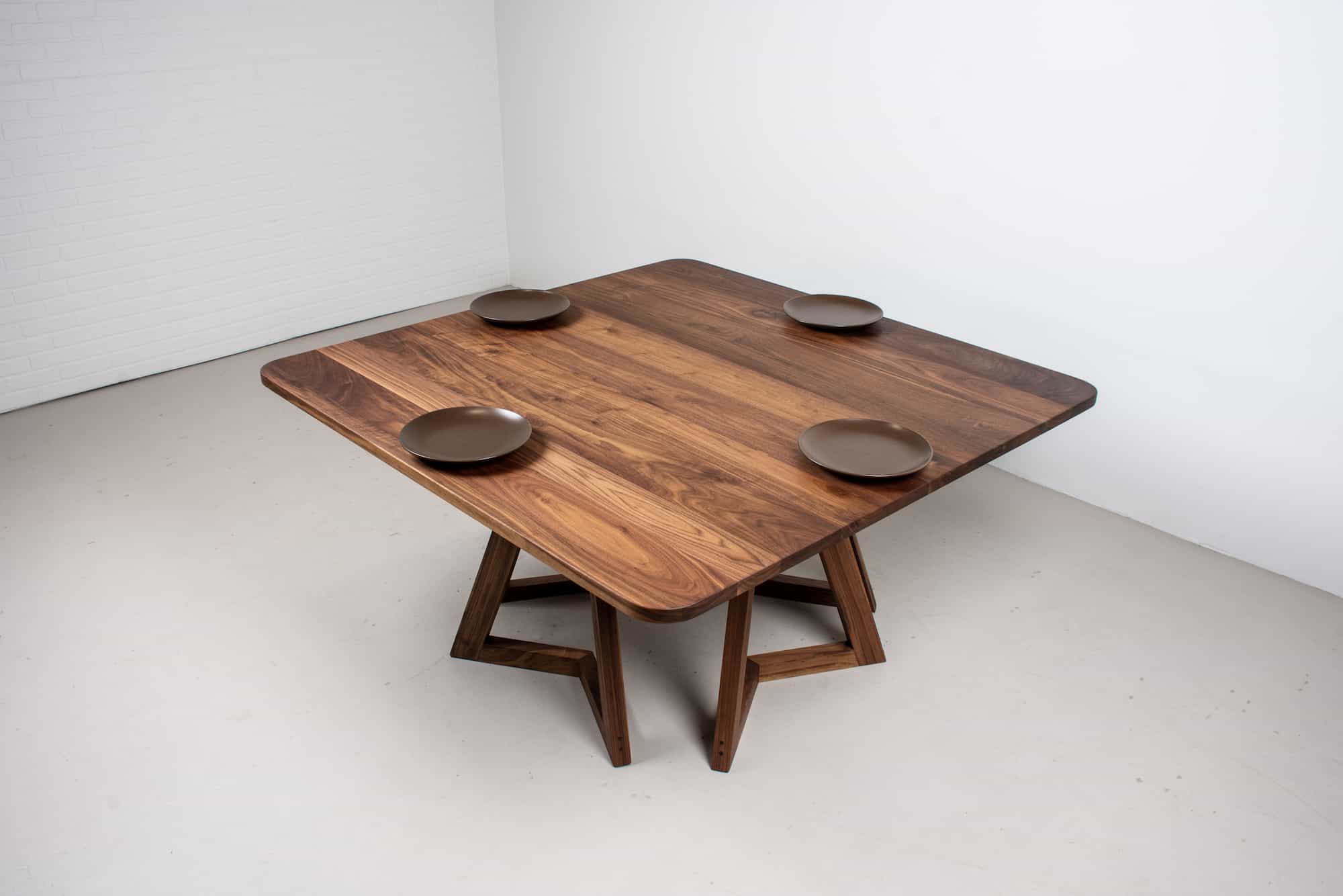 square walnut table on 4 walnut chevron legs