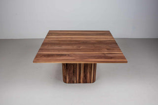 square walnut table on fluted walnut pedestal base