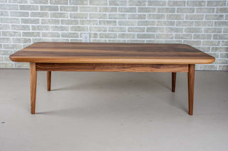 walnut coffee table on midcentury modern base