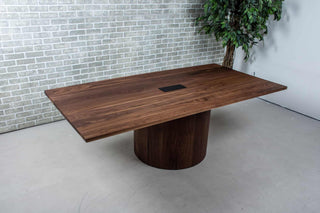 walnut conference table on cylinder pedestal base
