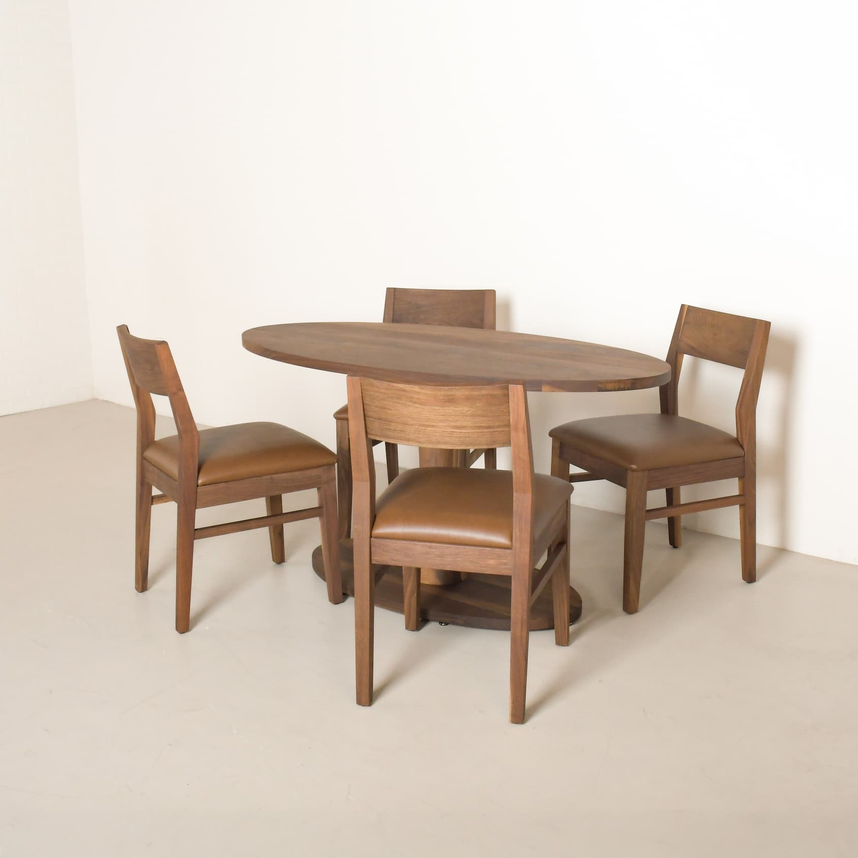 walnut elliptical table with 4 walnut chairs