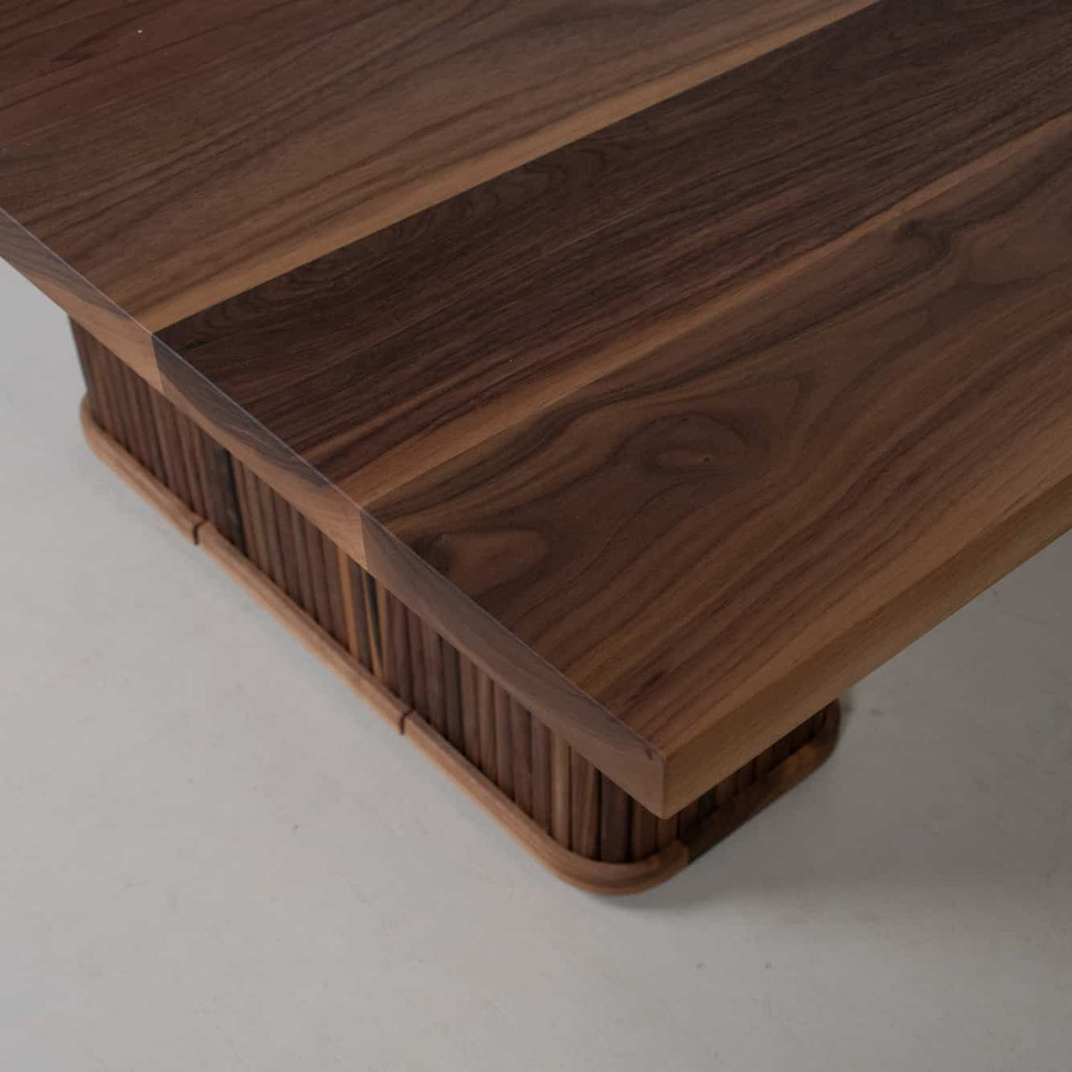 corner detail of a Walnut table 36