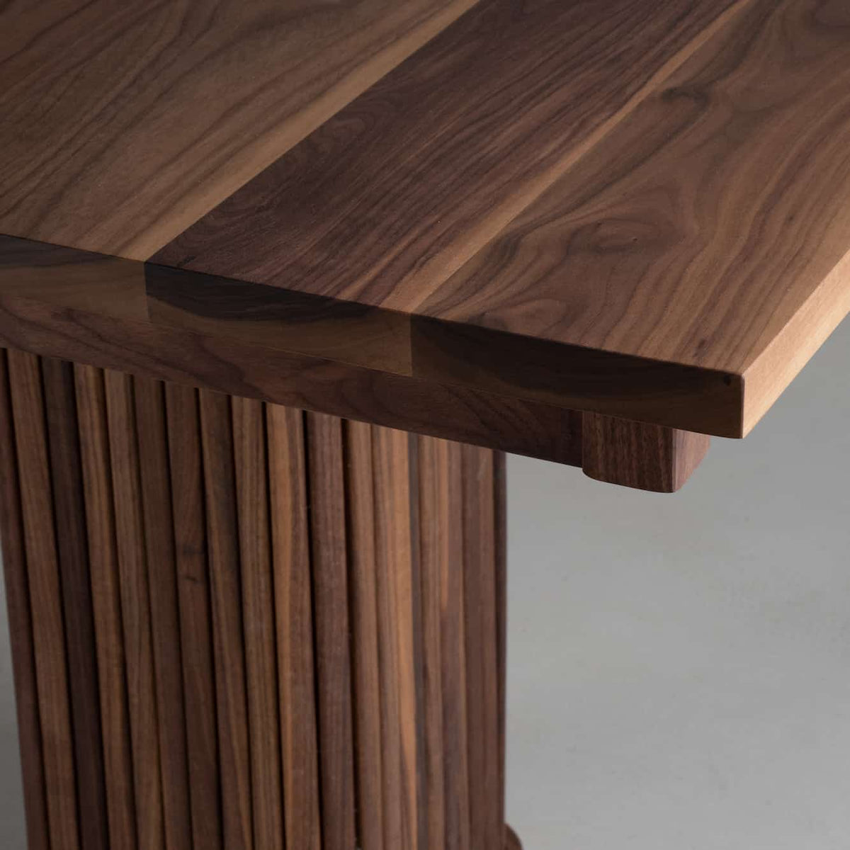 corner detail of a Walnut table 36
