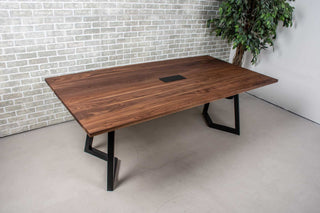 walnut meeting table with cut out for power supply grommet