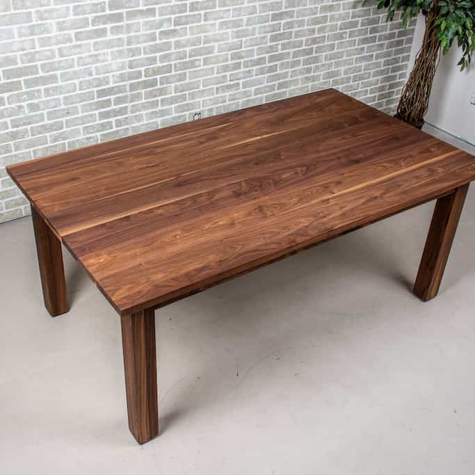 walnut dining table on a parsons base