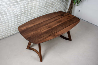 walnut squoval dining table on curved walnut legs