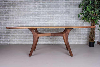 walnut squoval table on mid century modern base