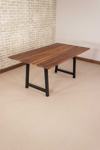 walnut table on black steel A legs