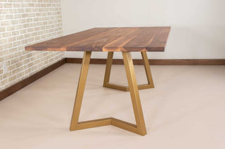 walnut table on steel chevron legs in gold