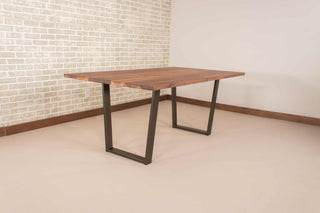 walnut table on steel angle legs in bronze