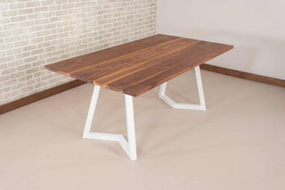 walnut table on white steel chevron legs