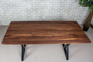 walnut table with nakina edge on steel legs