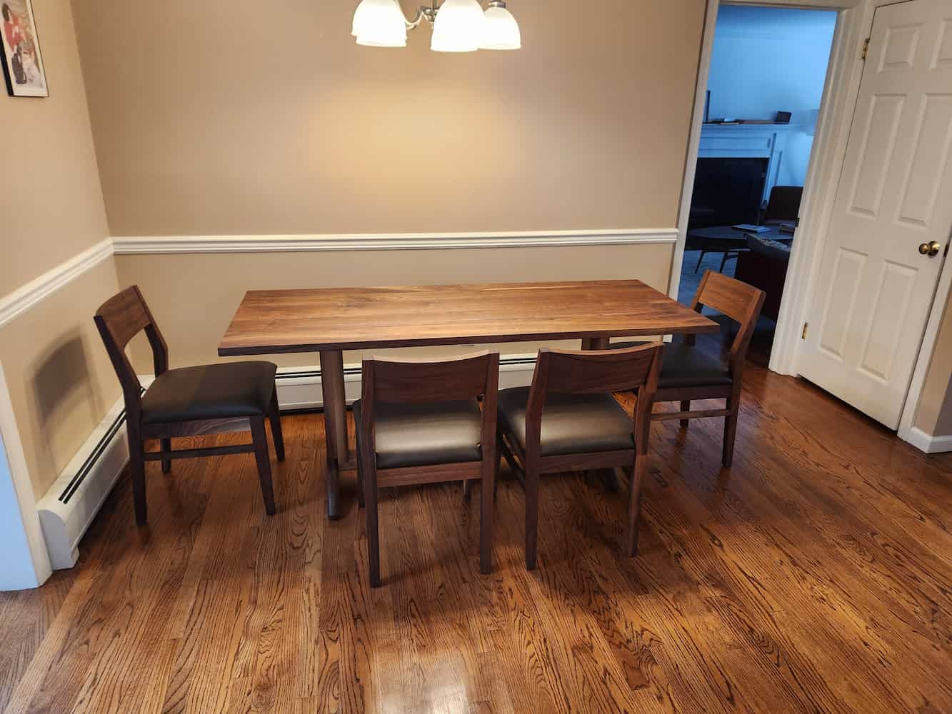 walnut trestle table and dining chairs