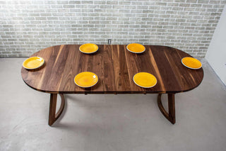 walnut racetrack oval extendable table on midcentury modern legs