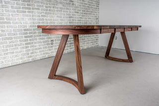 walnut racetrack oval extendable table on midcentury modern legs