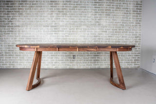 walnut racetrack oval extendable table on midcentury modern legs