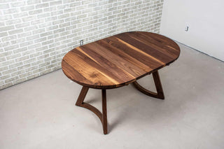 walnut racetrack oval extendable table on midcentury modern legs