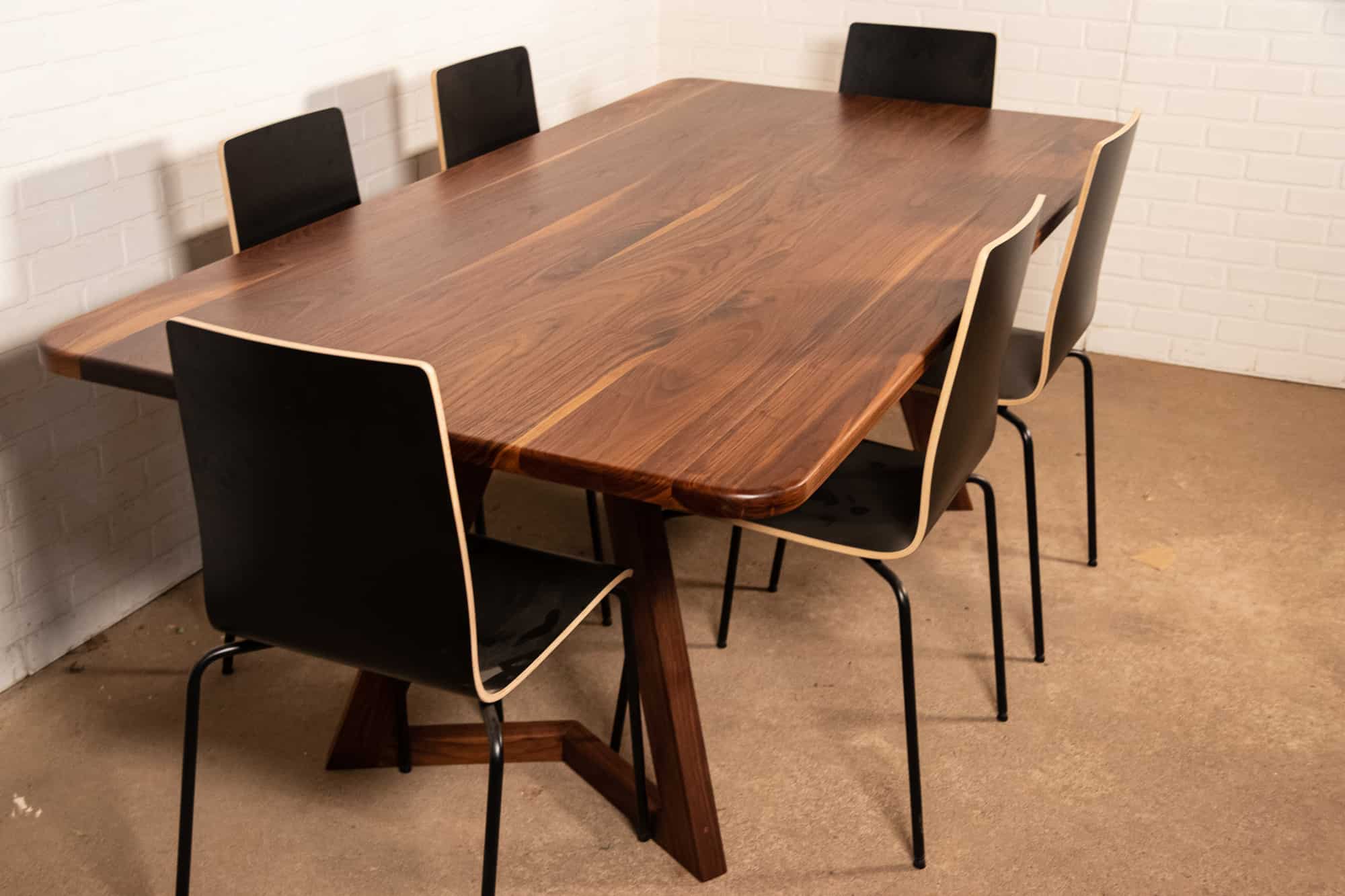 walnut table on walnut chevron legs