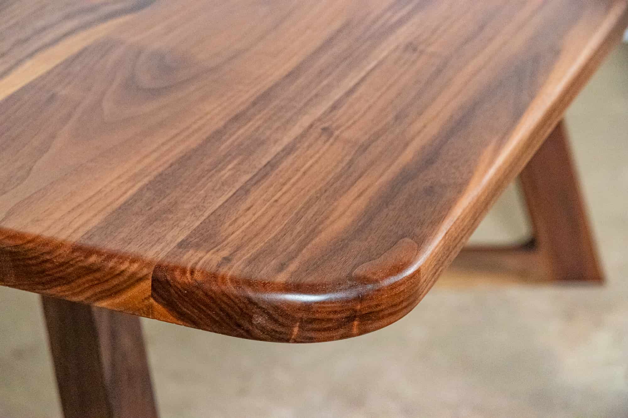 walnut table on walnut chevron legs