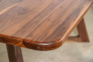 walnut table on walnut chevron legs