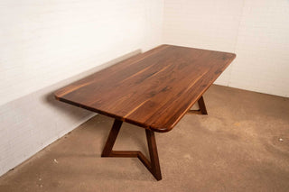 walnut table on walnut chevron legs