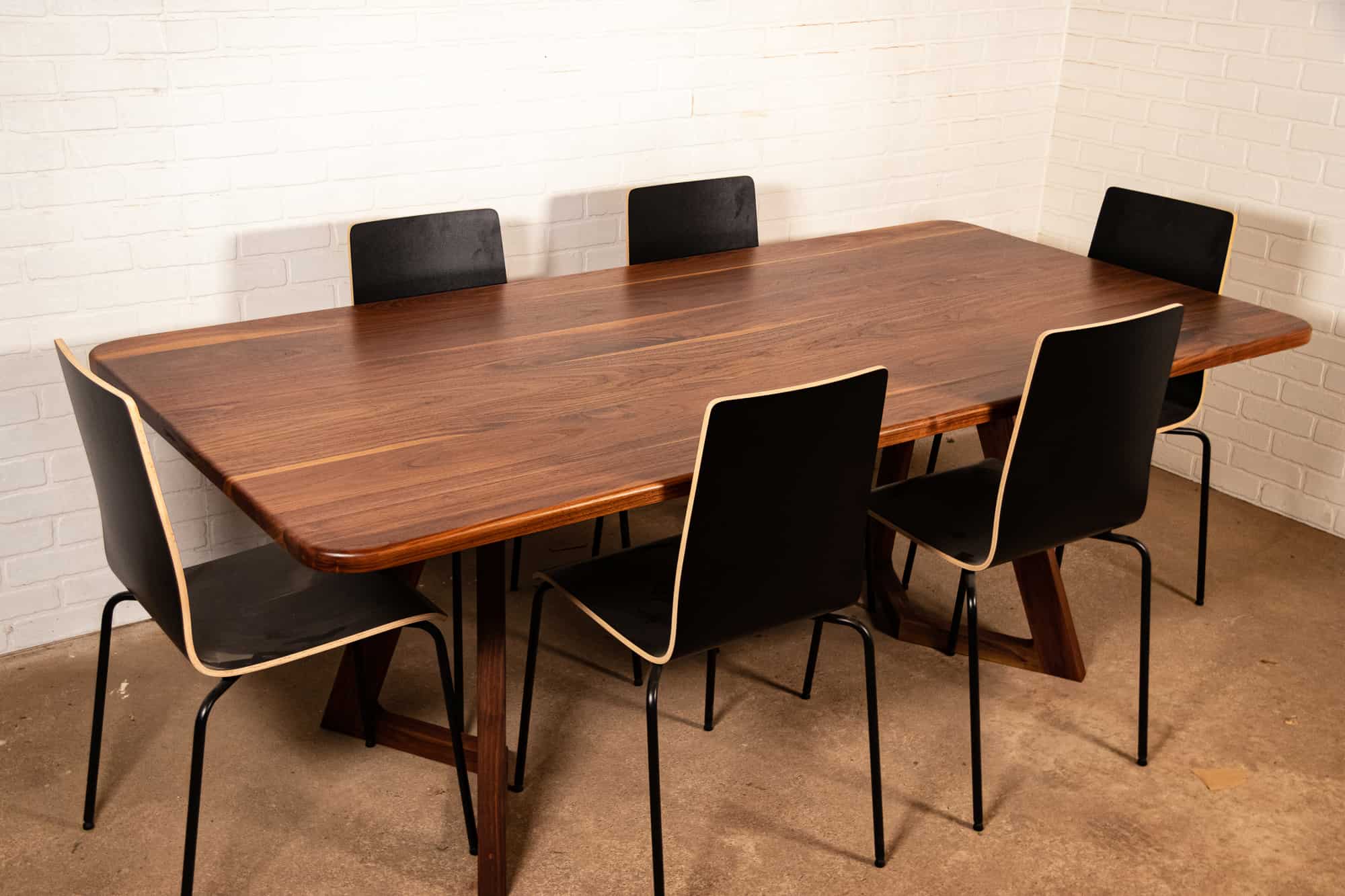 walnut table on walnut chevron legs