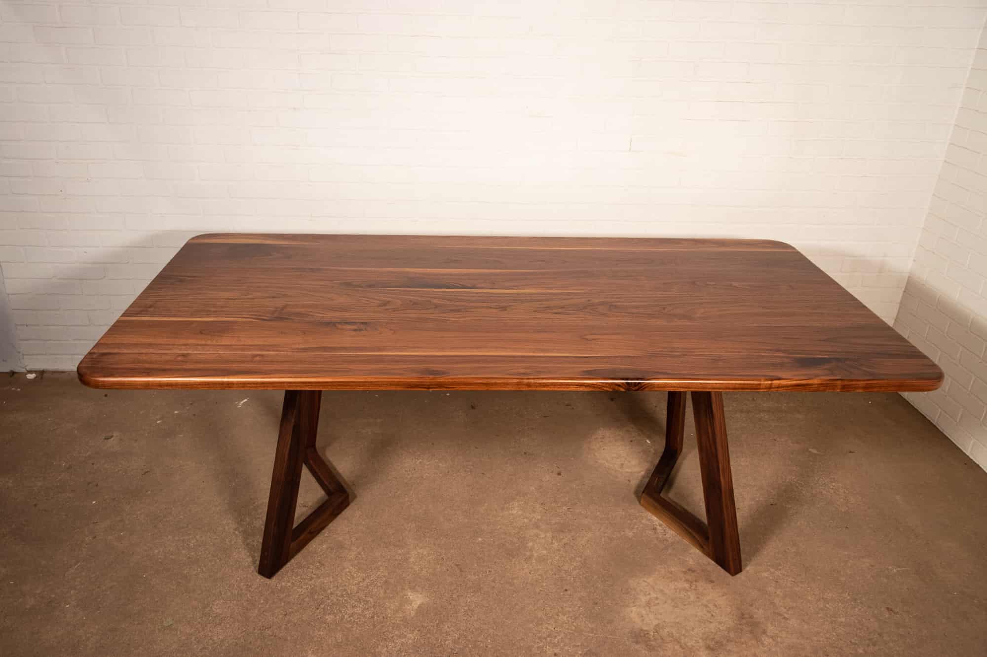 walnut table on walnut chevron legs