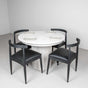 round white pedestal table with oak chairs finished in black
