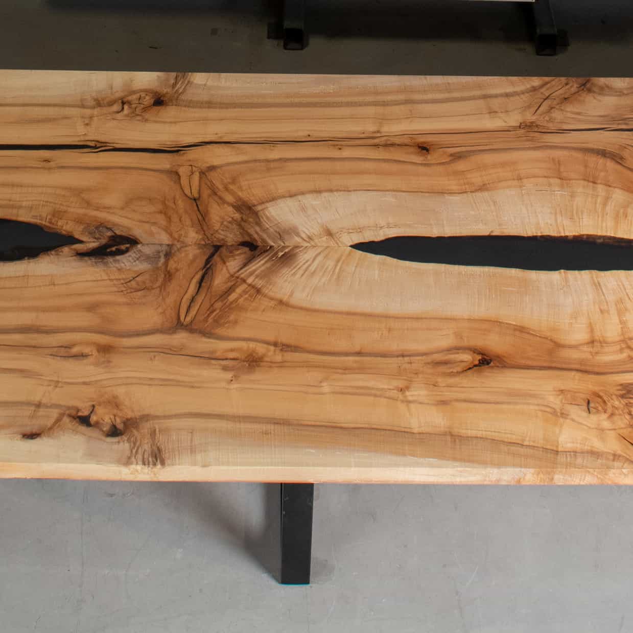 center of long maple table with epoxy