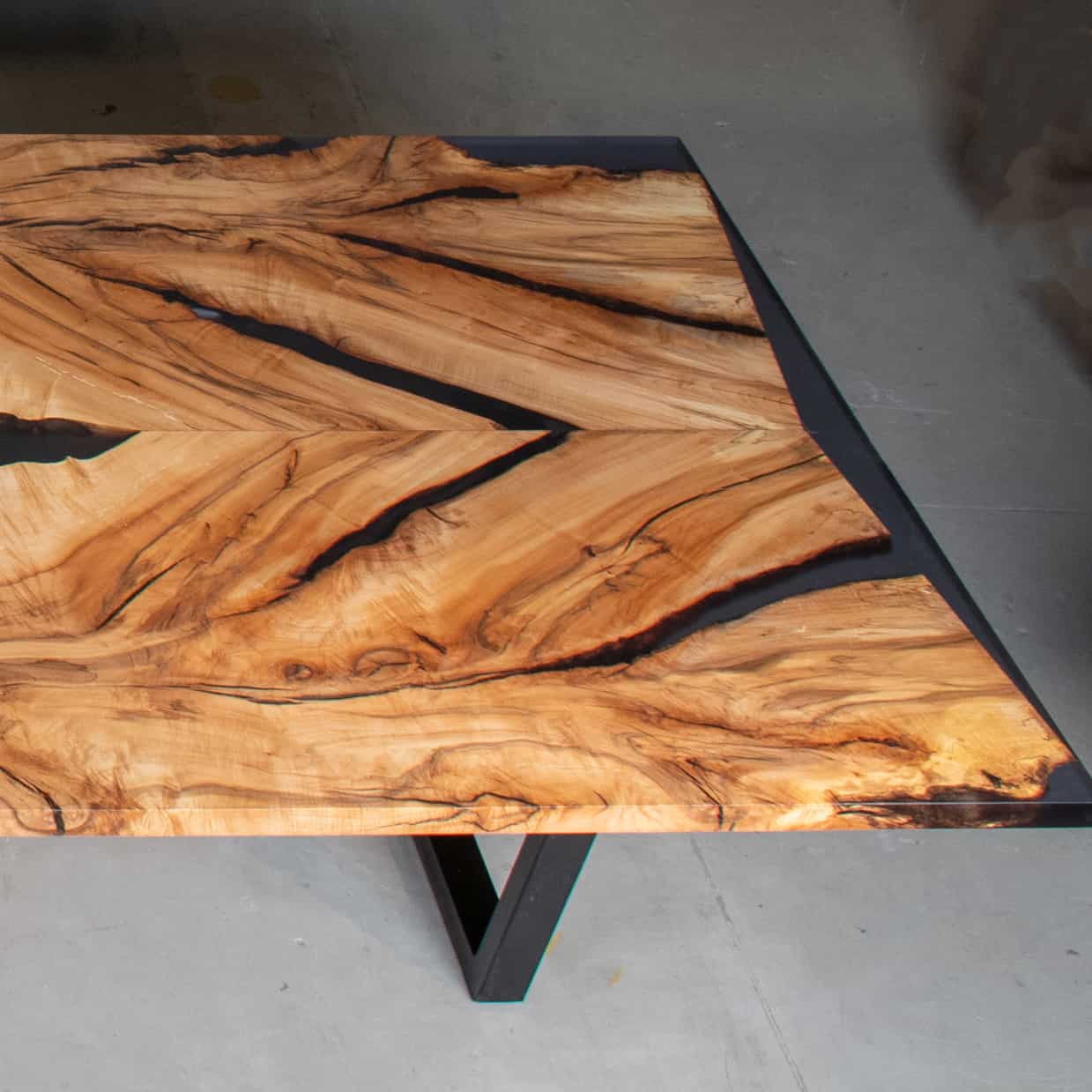 end of long maple table with epoxy