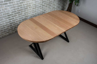 extendable oval dining table in rock maple on black steel legs