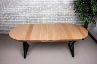 extendable oval dining table in rock maple on black steel legs