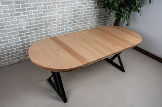 extendable oval dining table in rock maple on black steel legs