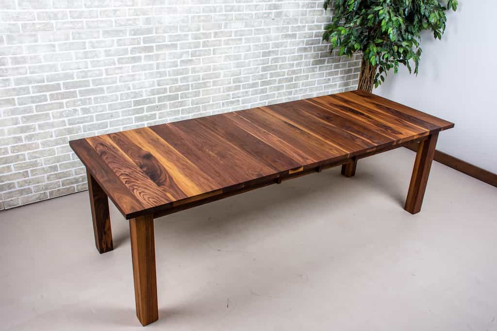 walnut extendable table on parsons base