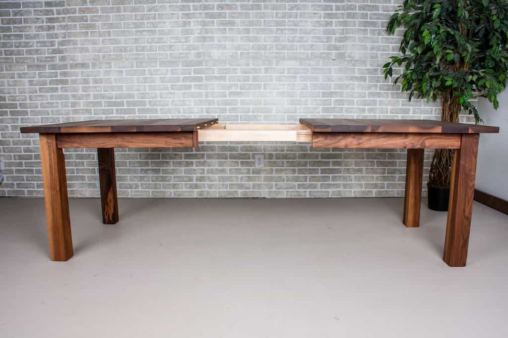 walnut extendable table on parsons base