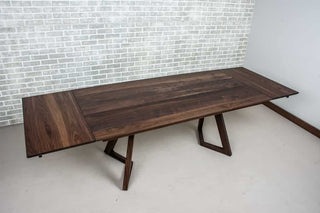 blackened walnut end extension table on walnut chevron legs